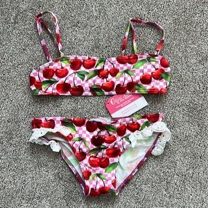 Selini action Two piece swim suit girls size 8 new. Runs a little small.